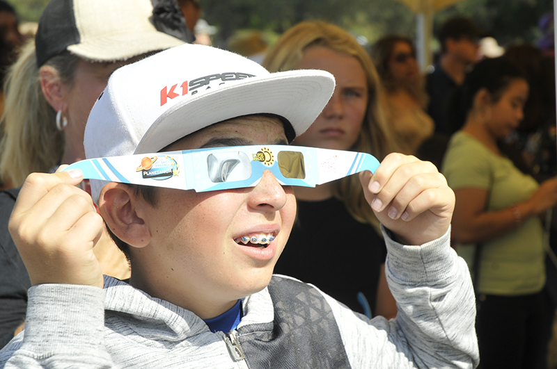 Kid looking at eclipse