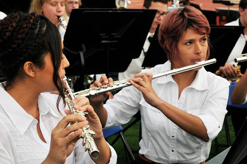 two girls playing flutes