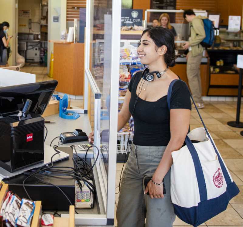 Student makes purchase at Prime Stop