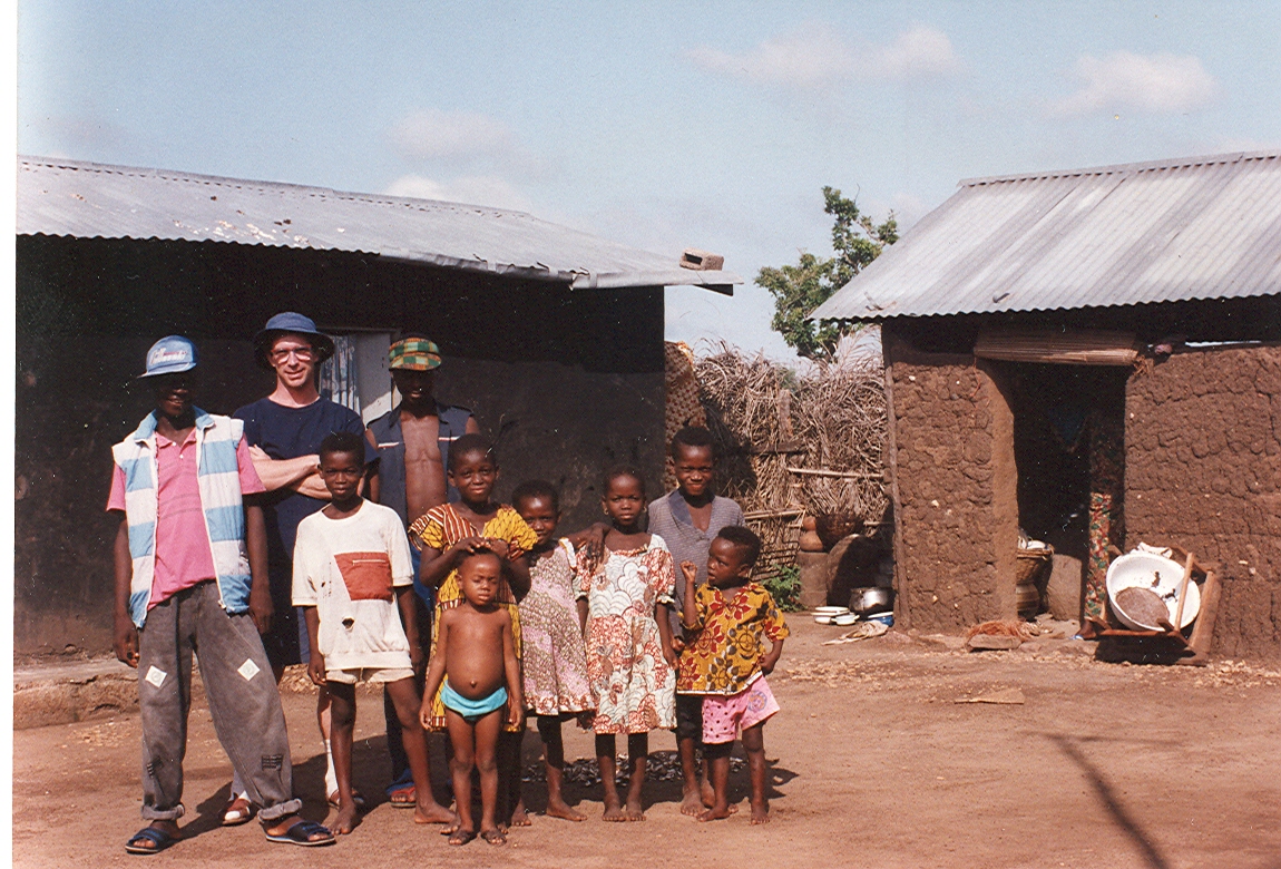 Prof. Rickard with community members from his Peace Corps assignment in Benin, West Africa