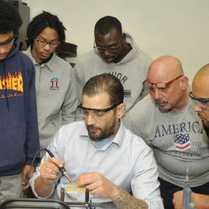 Students watching an instructor demonstration.