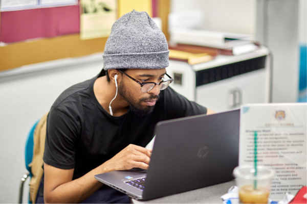 Student focused on laptop