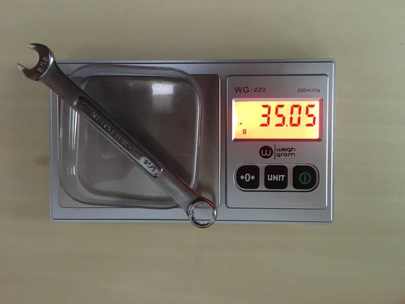 Picture showing balance with weigh boat, object, and digital readout