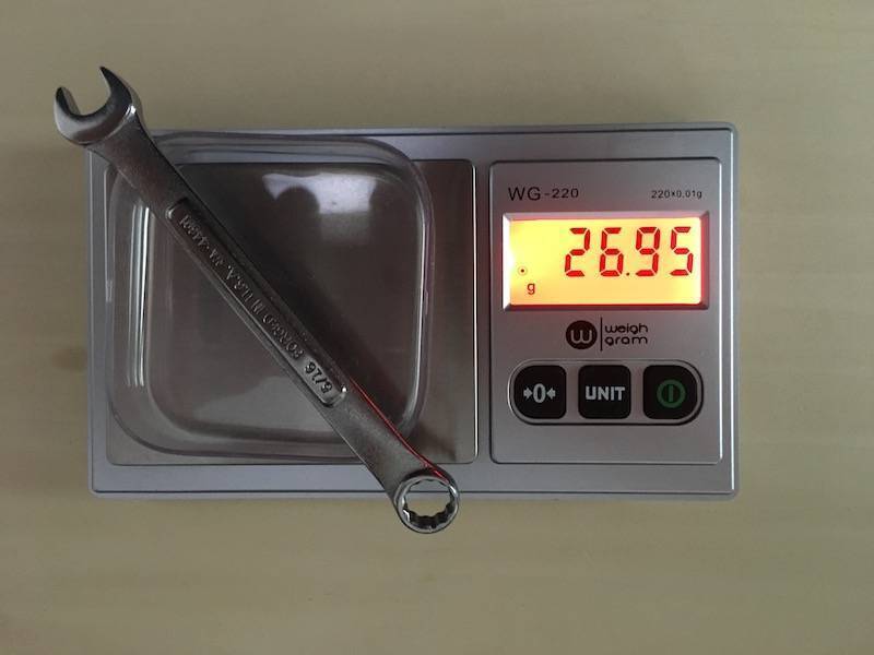 Picture showing balance with tared weigh boat, object, and digital readout