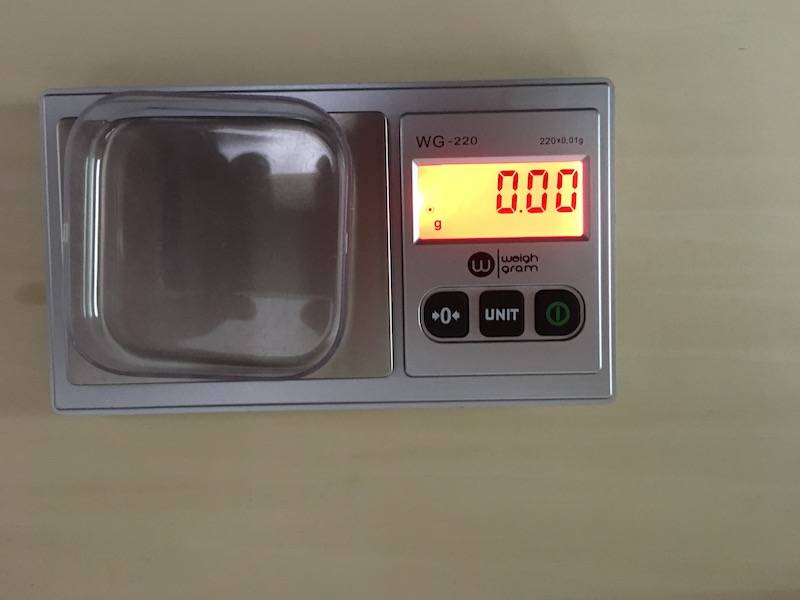 Picture showing balance with tared weigh boat and digital readout