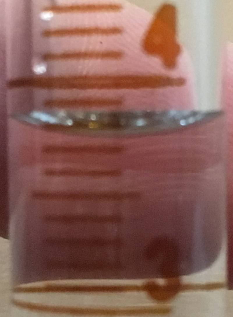 Close up of 10 mL graduated cylinder for reading