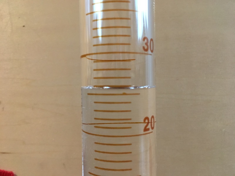 50 mL graduated cylinder filled for measurement practice