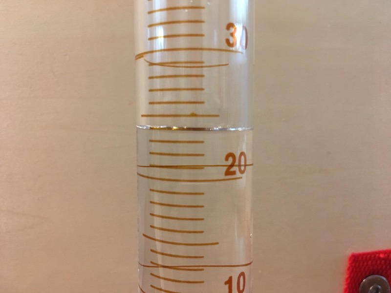Graduated cylinder with water for measuring