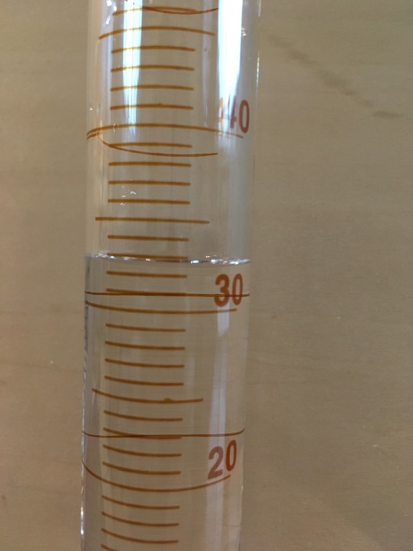 50 mL graduated cylinder filled for measurement practice