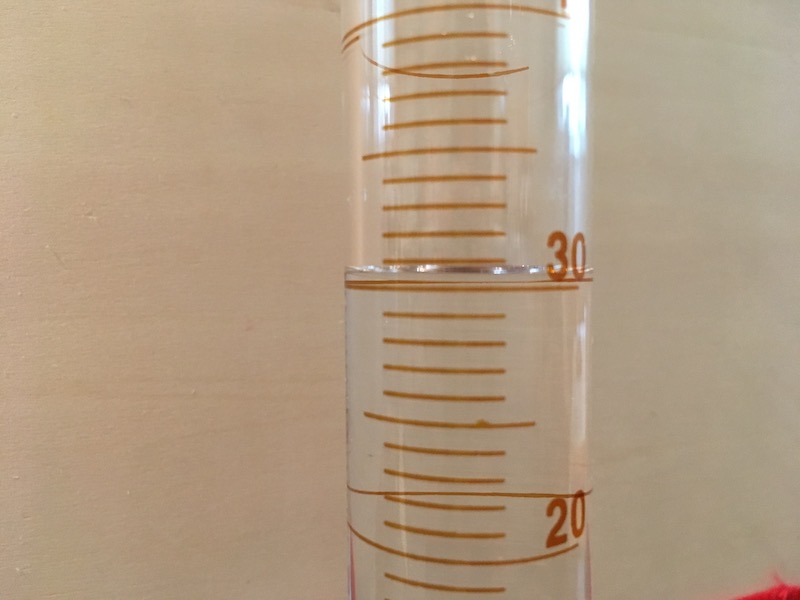 Graduated cylinder with water for measuring