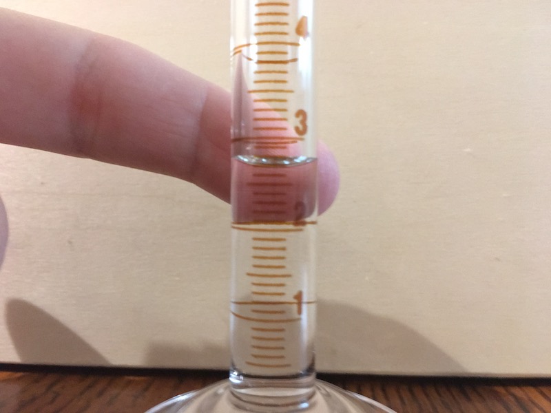 10 mL graduated cylinder filled for measurement practice