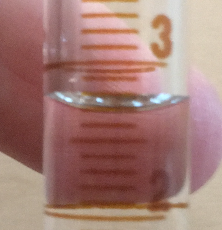 Close up of 10 mL graduated cylinder for reading