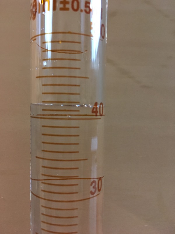 50 mL graduated cylinder filled for measurement practice