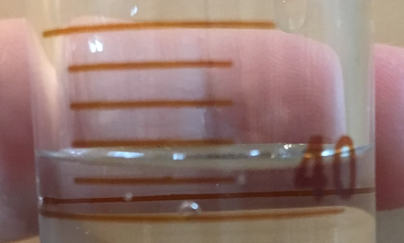 Close up of 50 mL graduated cylinder for reading