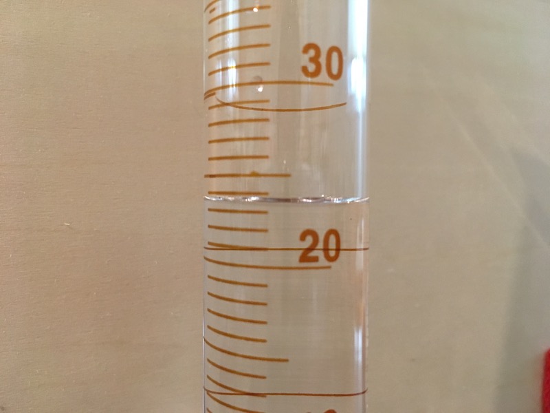Graduated cylinder with water for measuring
