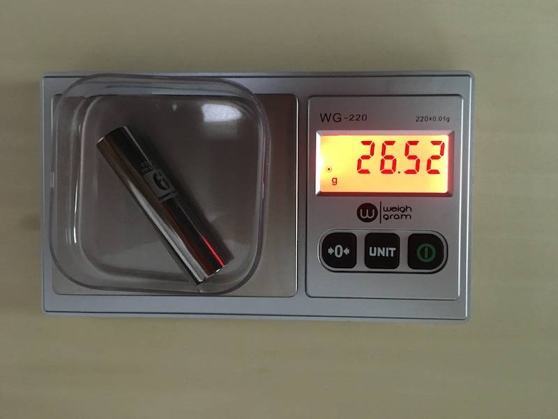 Picture showing balance with tared weigh boat, object, and digital readout