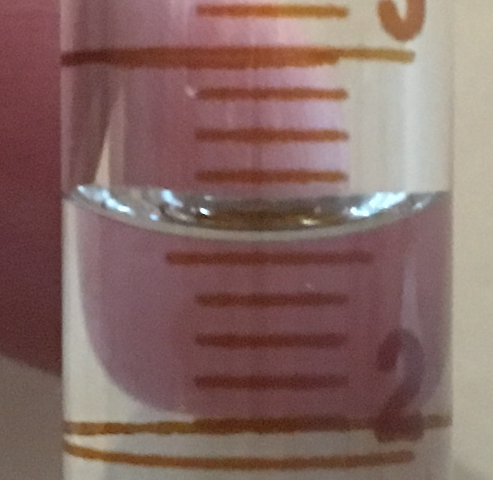 Close up of 10 mL graduated cylinder for reading