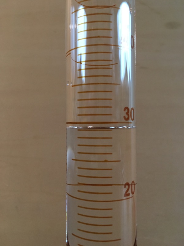 50 mL graduated cylinder filled for measurement practice