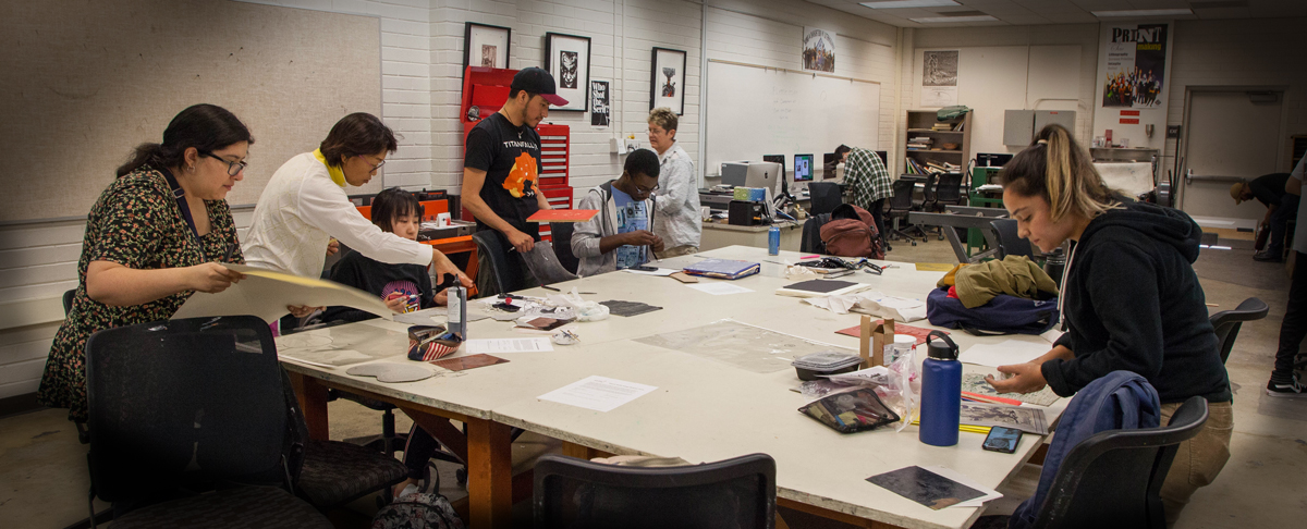 Students at printmaking table.