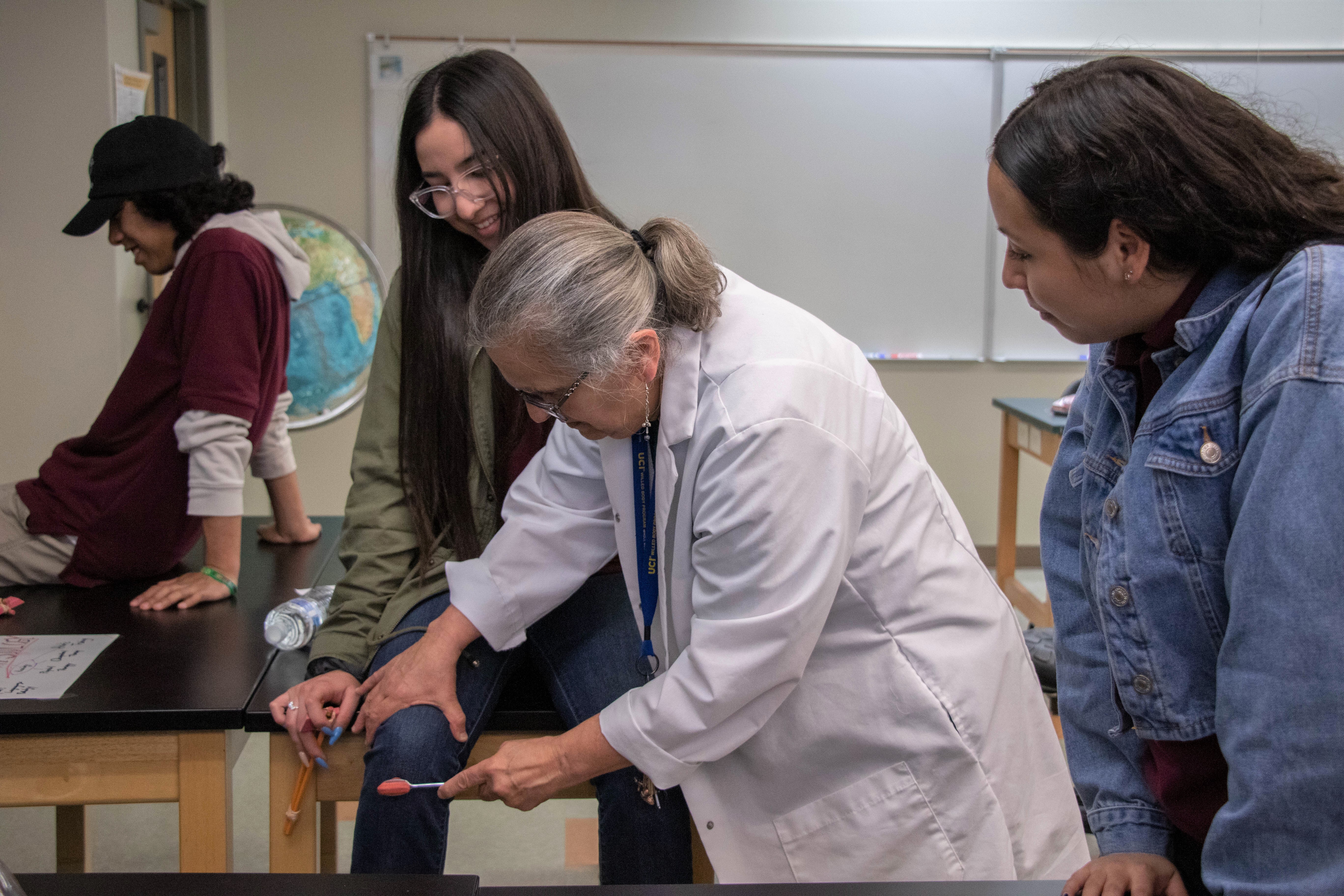 Students and teacher testing reflexes