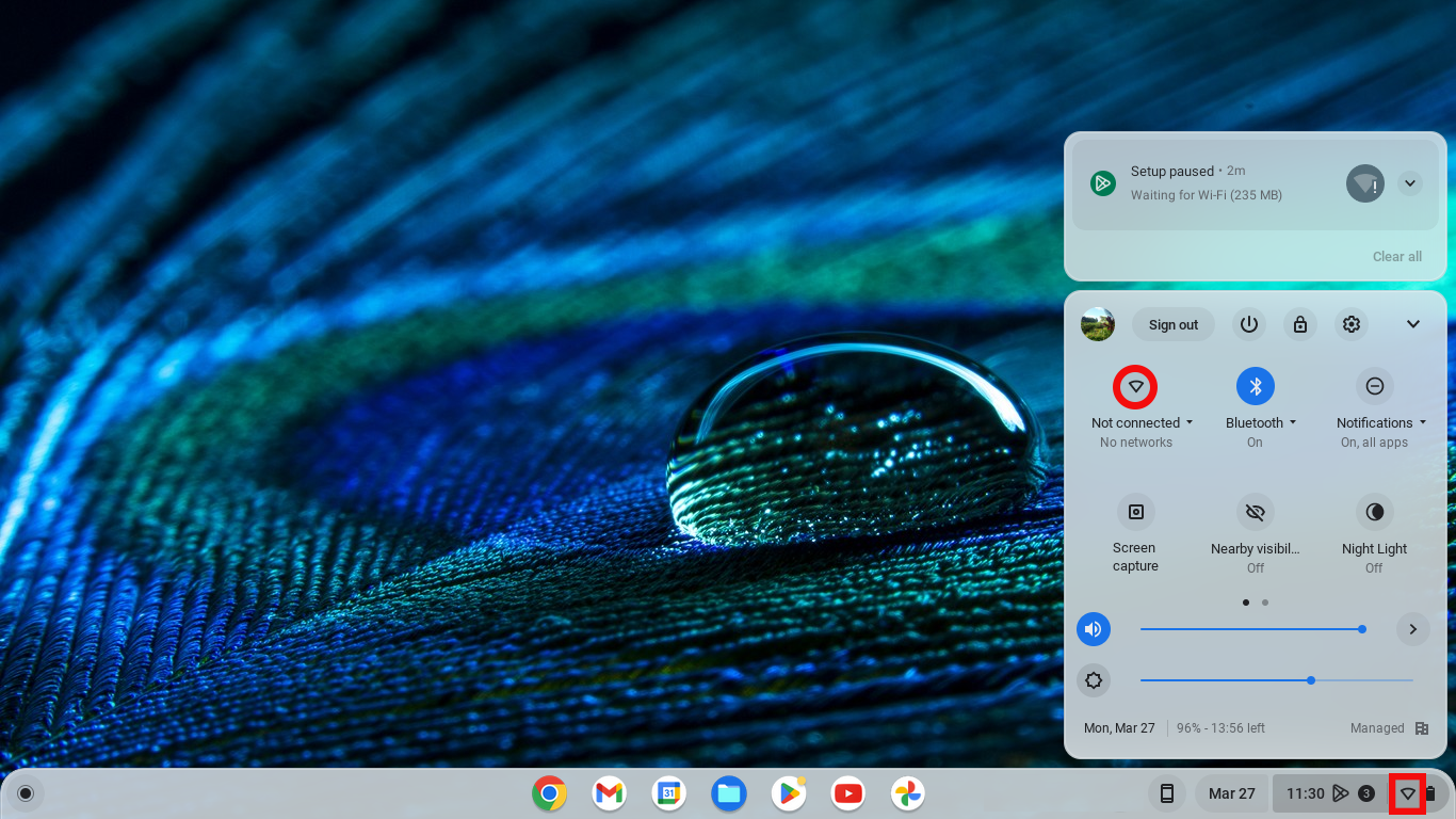 ChromeOS desktop with the network icon highlighted in the taskbar
