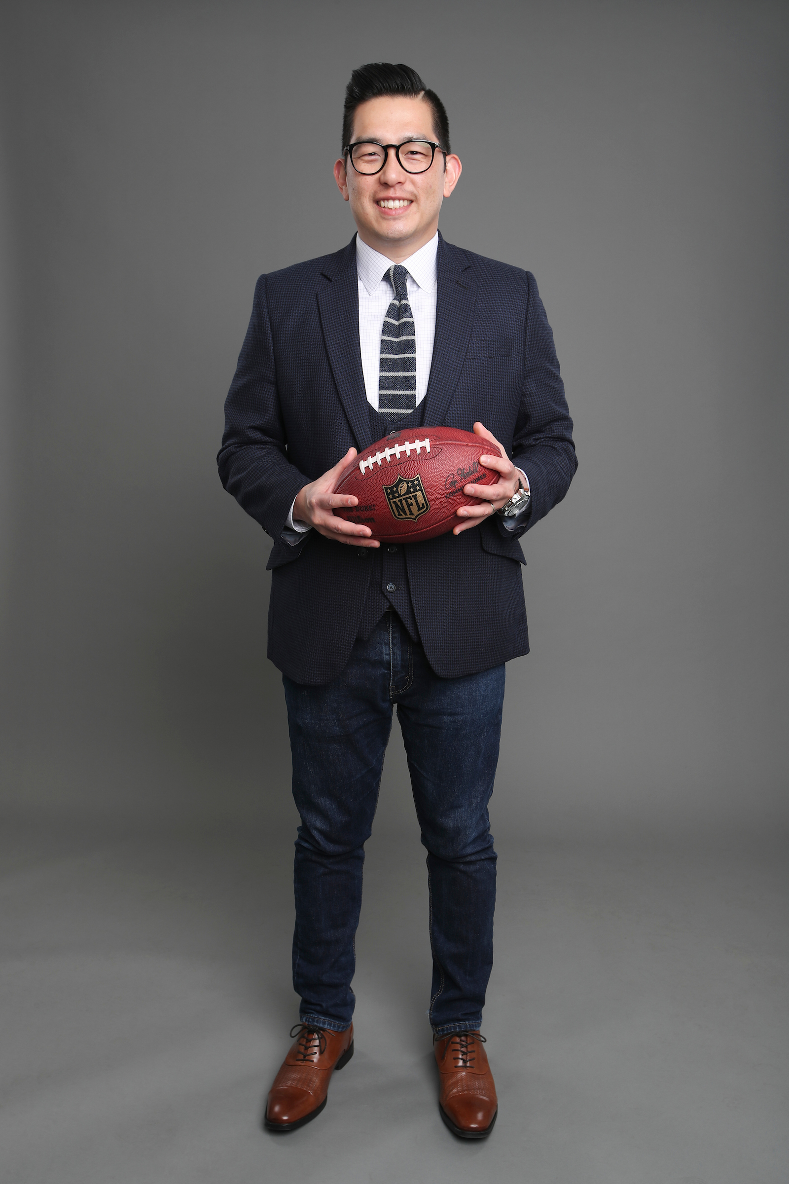 James Koh pictured holding a football