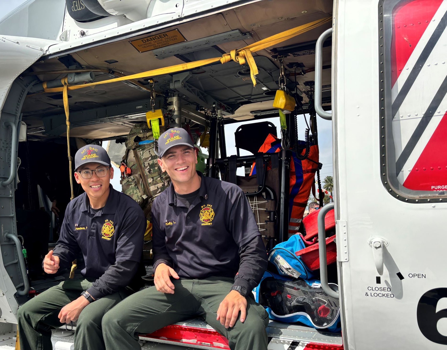 Students on side of helicopter