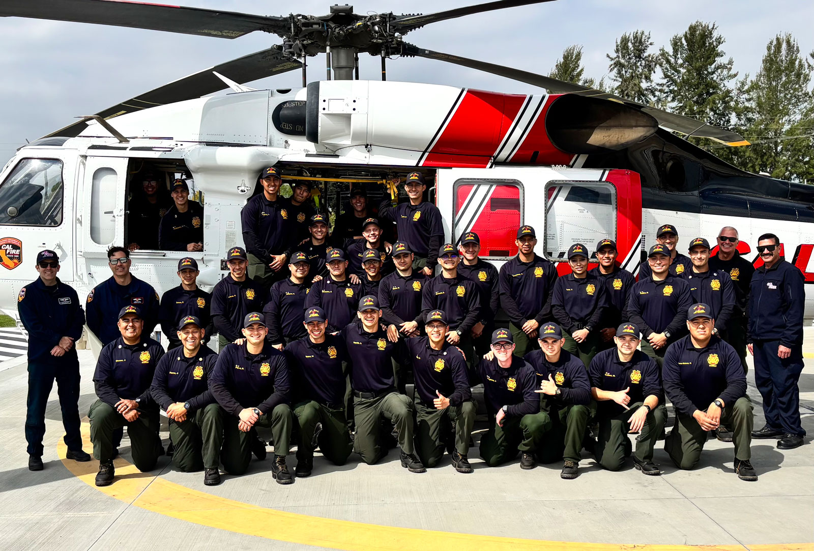 Mt. SAC Wildland Fire Academy Students standing beside CalFire Helicopter