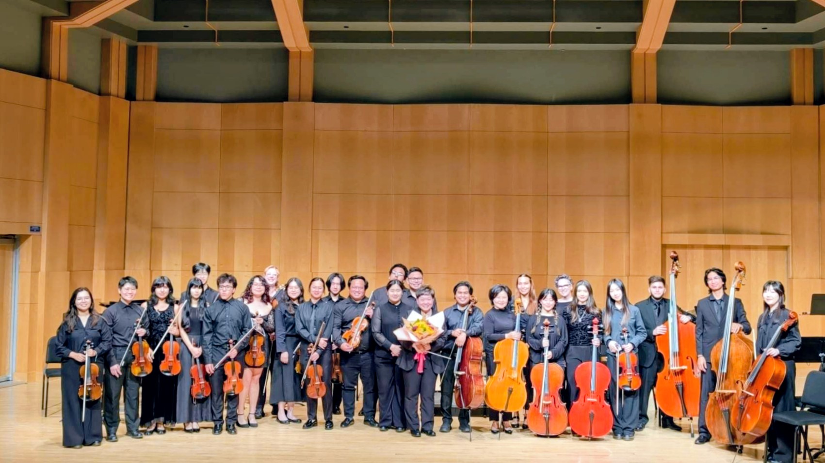 Orchestra students on stage following a concert