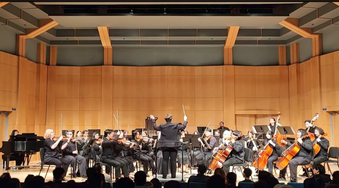 Orchestra students perform on stage