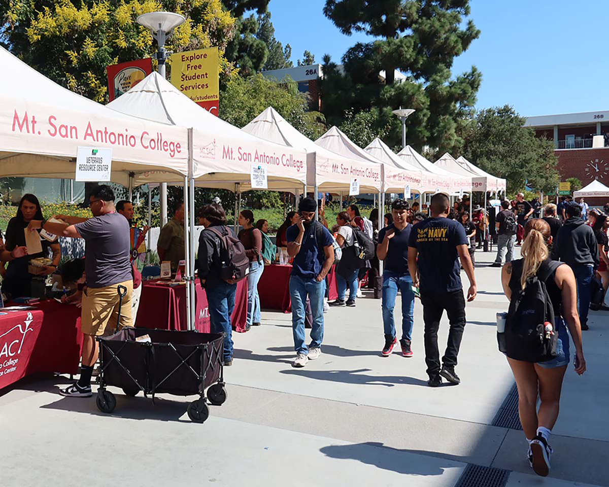 Clubs and organizations have booths set up on campus for students to visit and gather information.