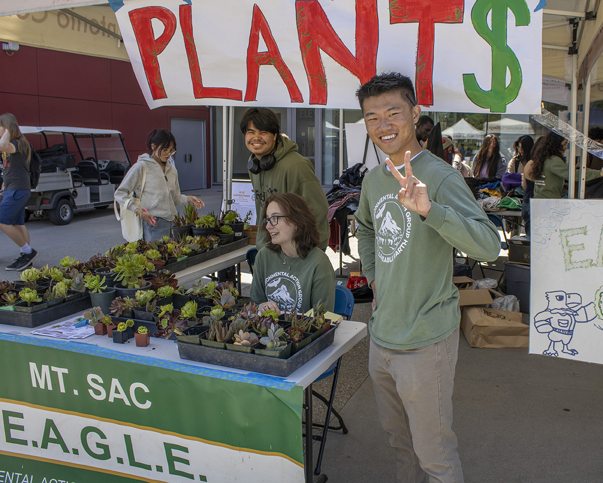 Mt. SAC students work a booth at an Earth Day Fair.
