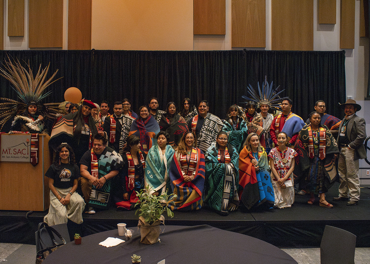 A group of students pose for a photo at a First Peoples Native Center event.