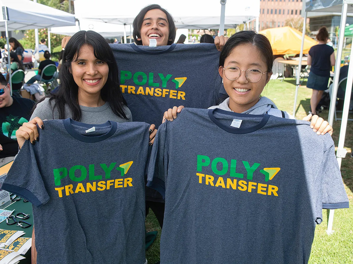 Transfer students hold up Cal Poly Pomona shirts.