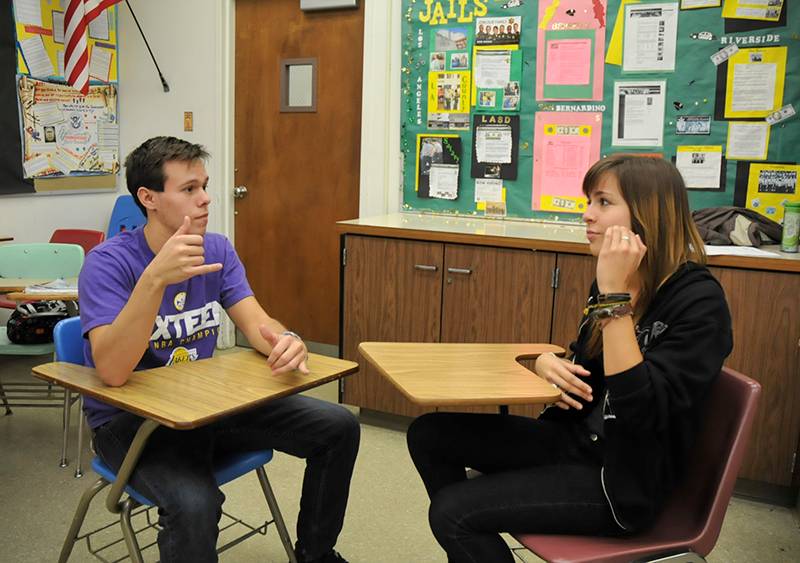 two students signing