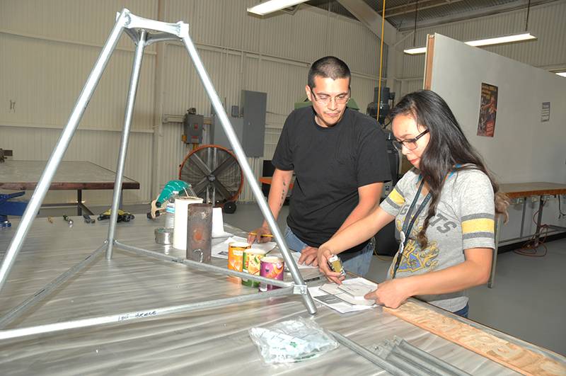 two students working on a project at the Makerspace facility