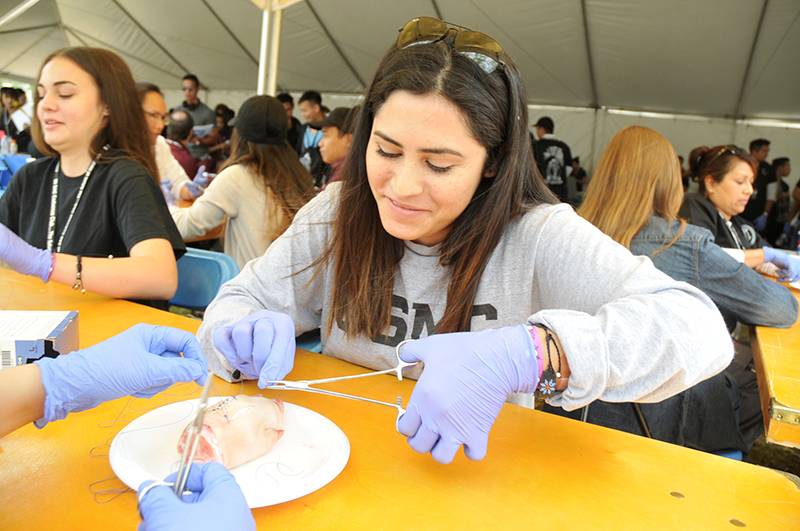 Girl practicing suture