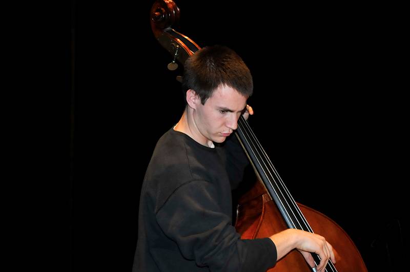 student playing the bass