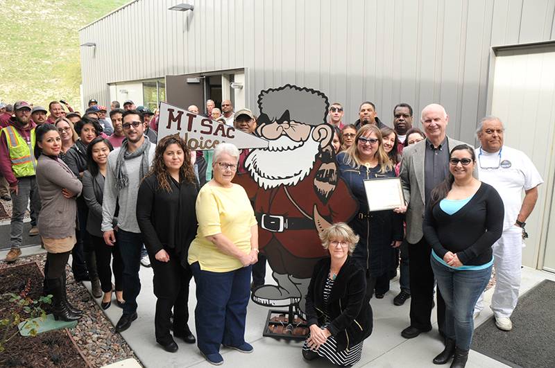 Mt. SAC's facilities department posing with award