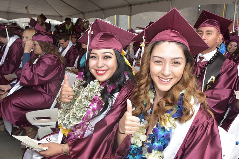 a picture of two students at graduation