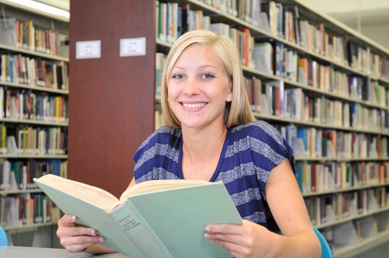 a student reading in the library