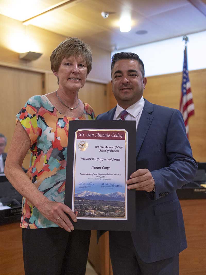 Sue Long with Board President Robert Hidalgo