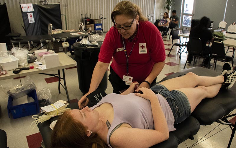 A student gives blood