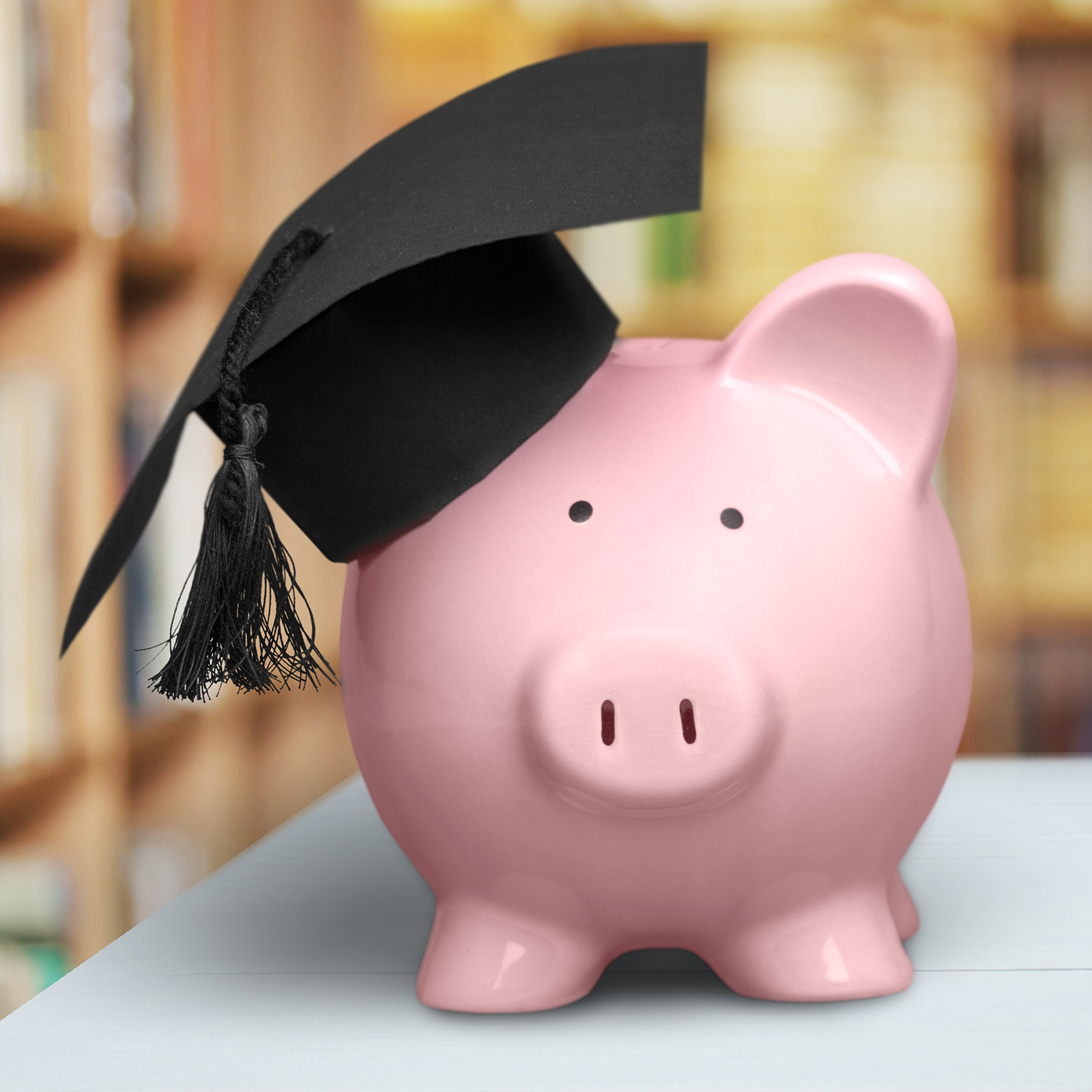 Piggy bank with graduation cap