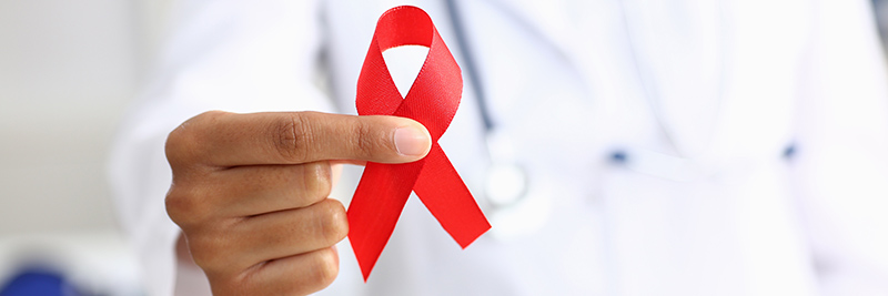 Doctor hold AIDS awareness ribbon