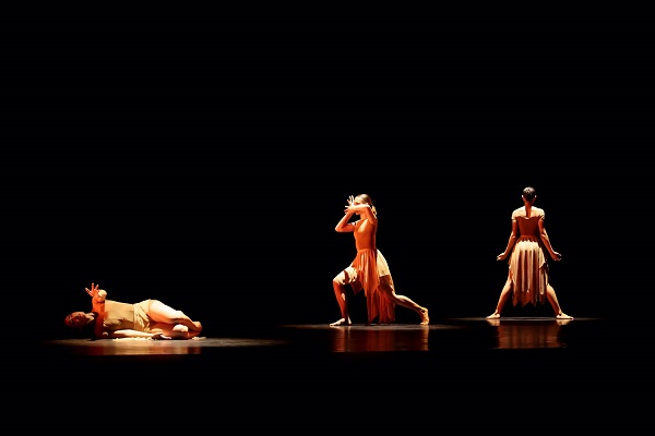 Three dancers on stage
