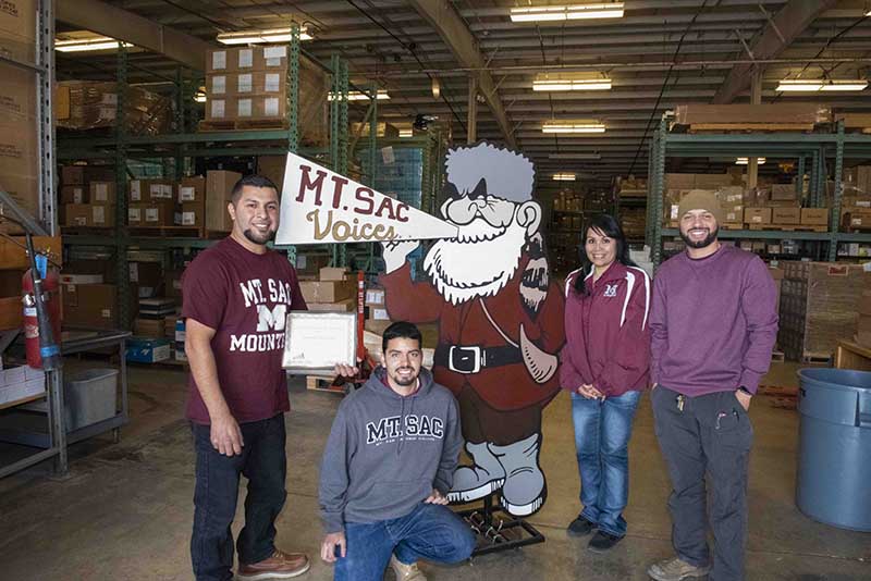 Ruben Flores gives the Warehouse staff the award