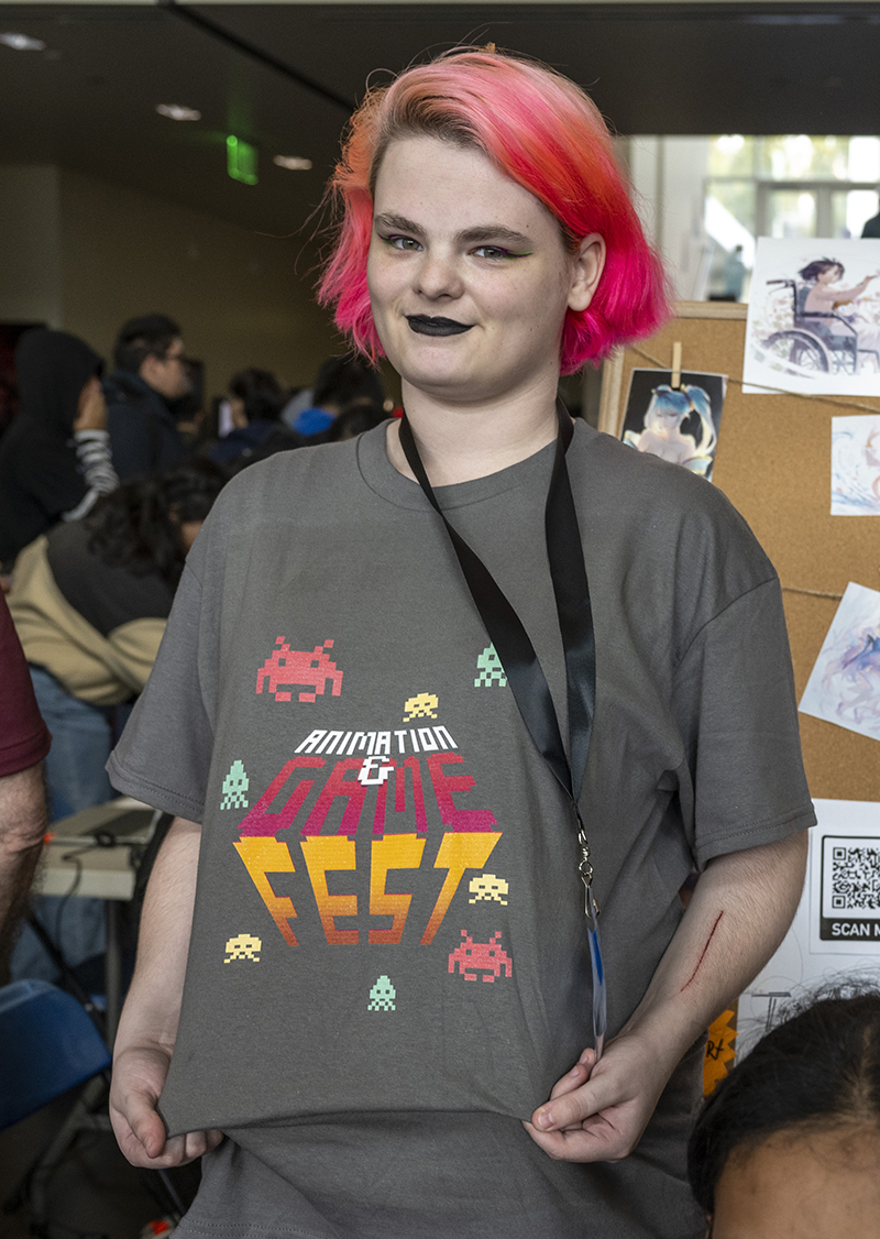 Student shows off a Gamefest shirt.