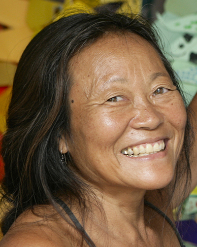 Peggy Oki smiles for the camera.