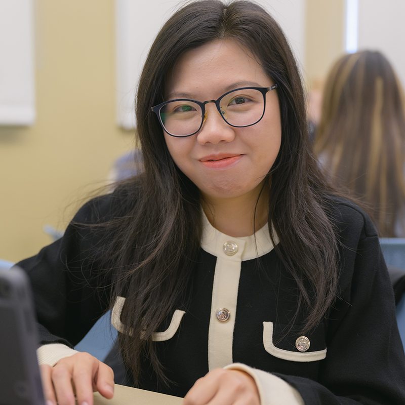A student smiles at a scholarship event.